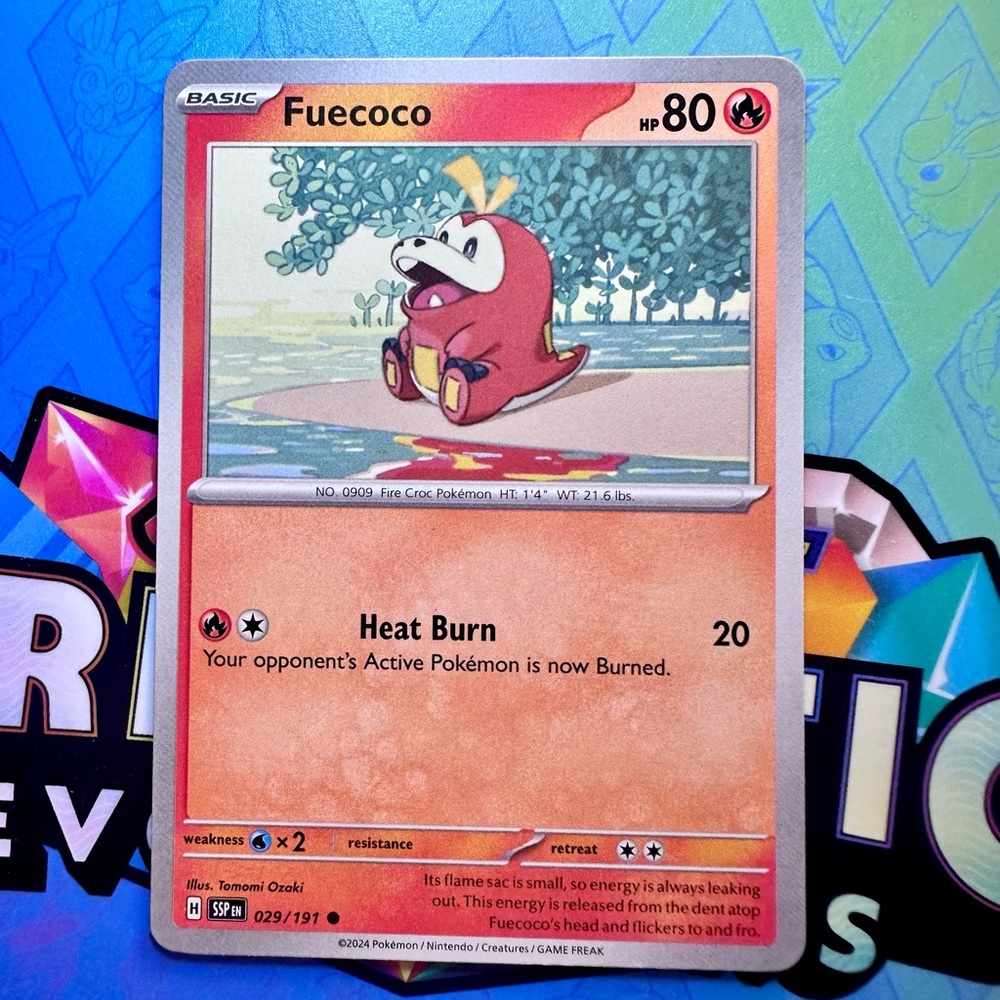 fuecoco (029/191) - common — pokémon: surging sparks